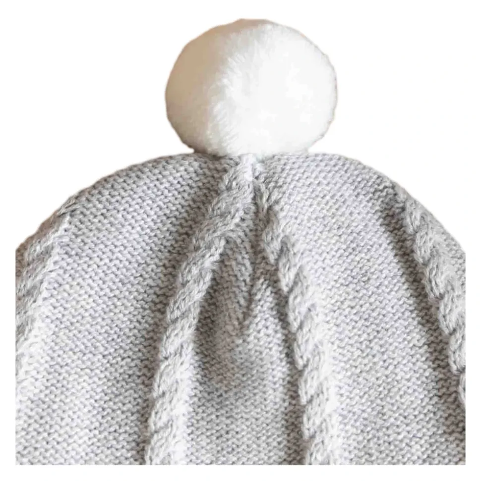 Bonnet en maille avec pompon et cache-oreilles